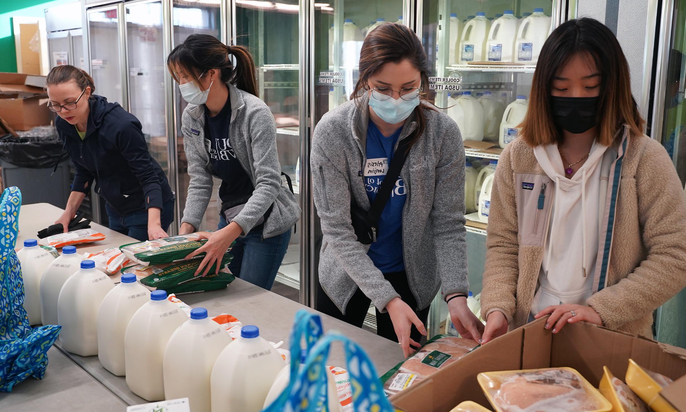 An image of students volunteering at Gleaners